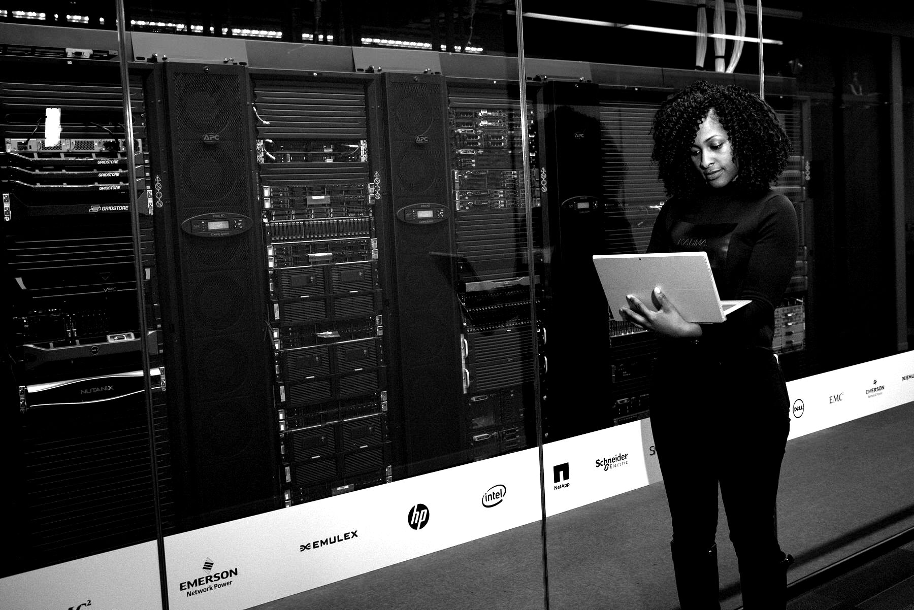 Engineer working among data-center server racks