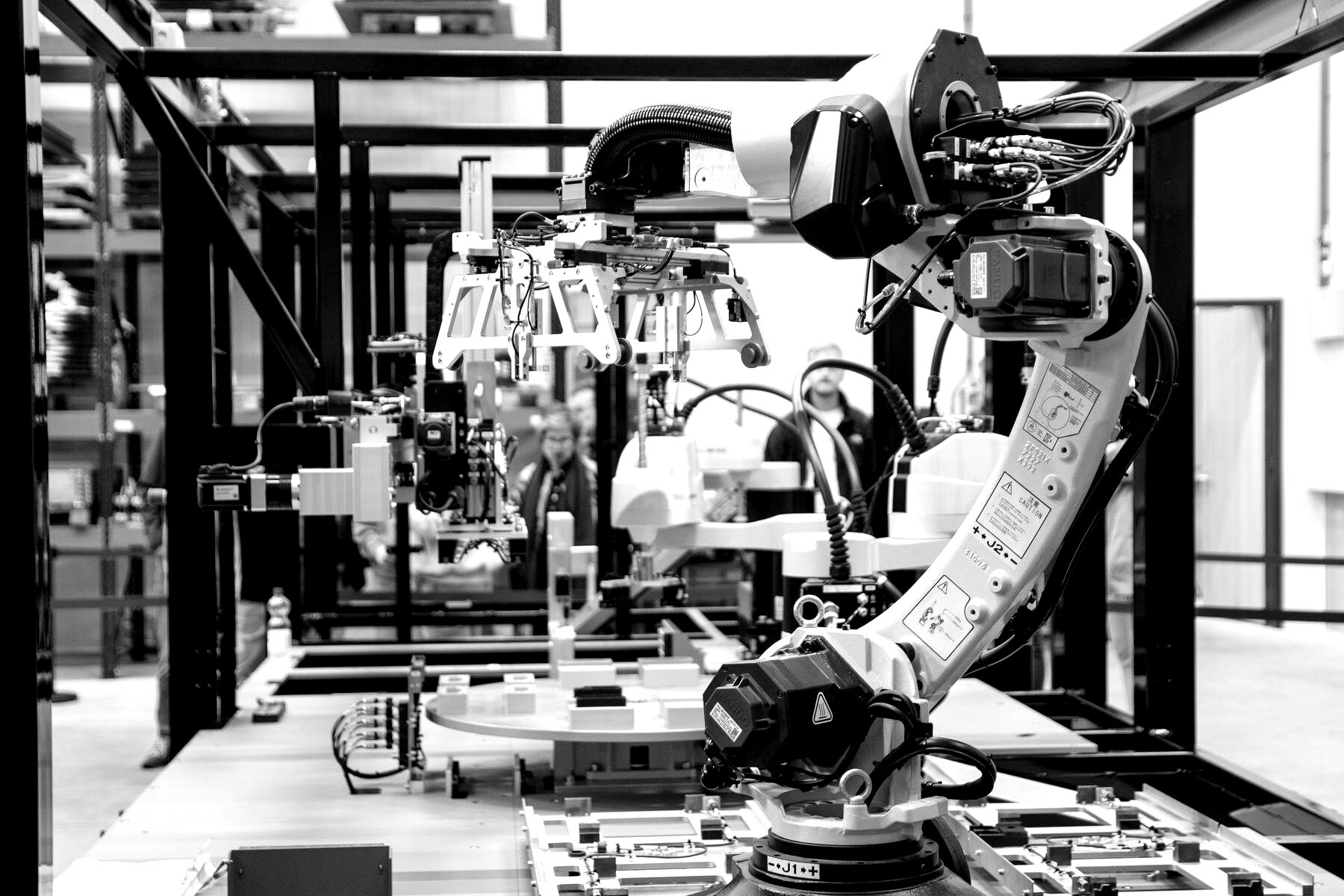 Industrial robot arms in a robotics manufacturing lab